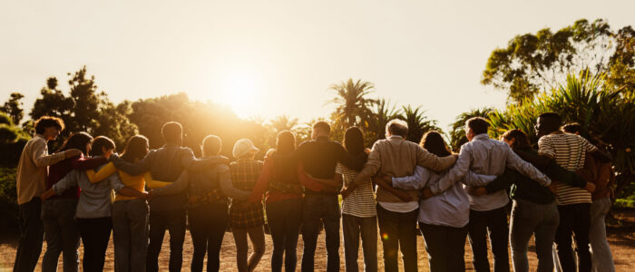 Back view of happy multigenerational people having fun in a publ